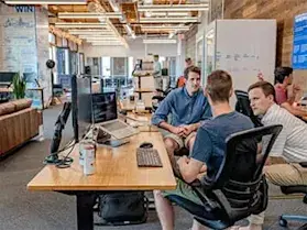 Developers collaborating in modern office space